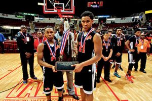 Leo senior captains Darius Branch (left) and Darias Oliver pose with the Lions’ runner-up trophy after the Class 1A state championship game. Branch started every game in his Leo career with Oliver contributing as a three-year starter. The pair led the Lions this year on a memorable campaign. (photo courtesy of VIP Photography)